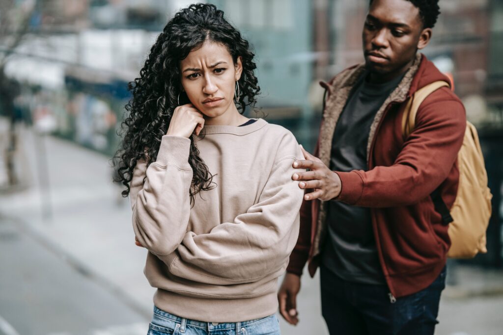 A man comforting a woman in distress. 