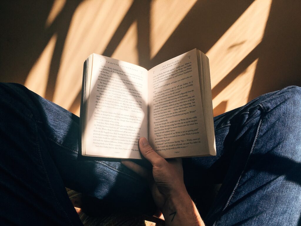 A man reading a book. 