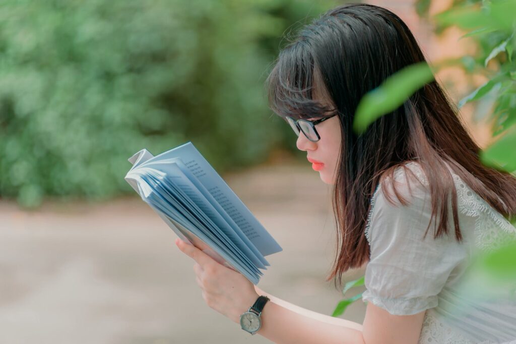 A girl reading a book. 